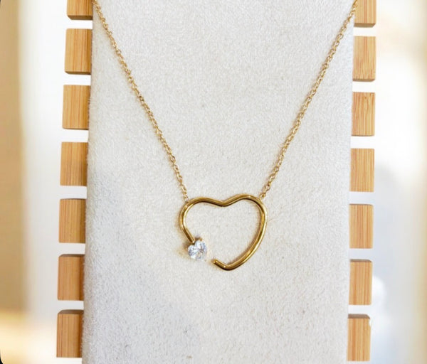 Collana cuore vuoto con punto  luce forma cuore due   varianti colore