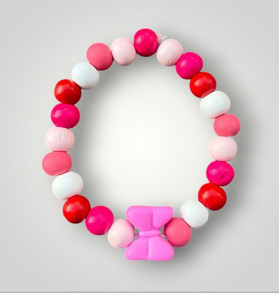 Bracciale colors con fiocco fuxia
