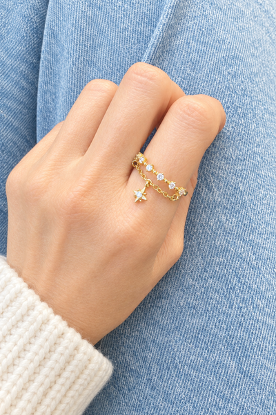 Anello regolabile con catenina e stella polare pendente