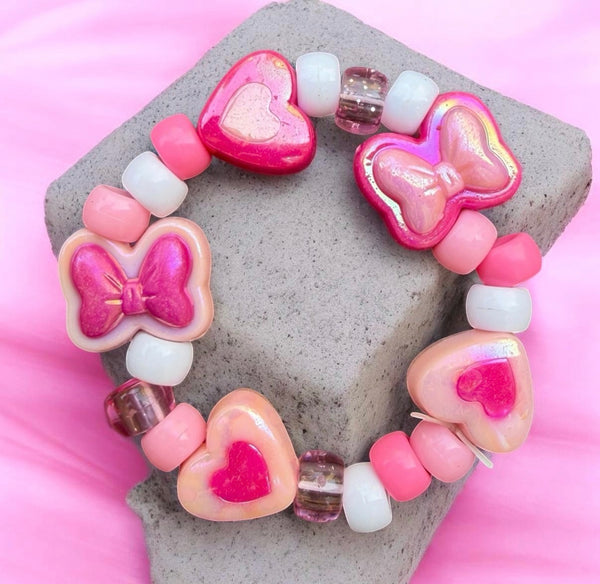 Bracciale Colors fiocchi cuori e pony Beads rosa e fuxia