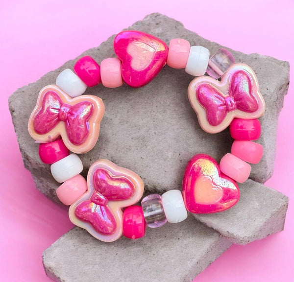 Bracciale Colors fiocchi cuori e pony Beads rosa e fuxia