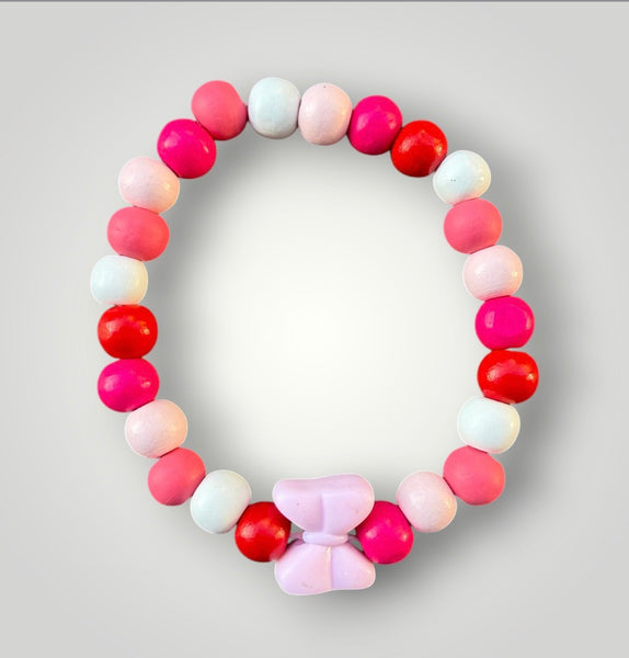 Bracciale colors con fiocco rosa