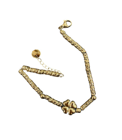 Bracciale catenina con dadini e quadrifoglio puff