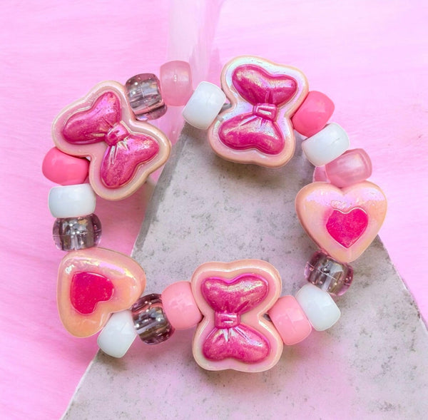 Bracciale Colors fiocchi cuori e pony Beads rosa