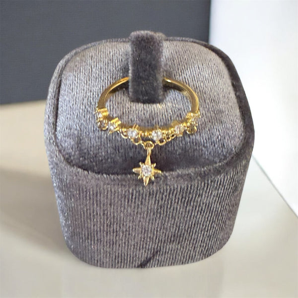 Anello regolabile con catenina e stella polare pendente