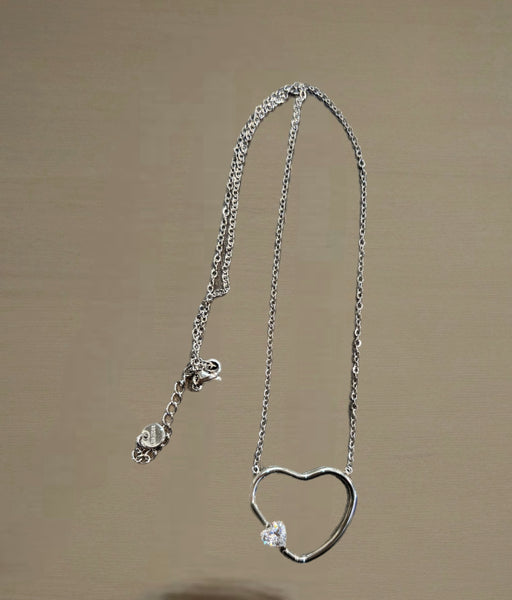 Collana cuore vuoto con punto  luce forma cuore due   varianti colore