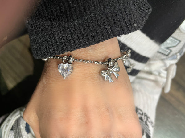 Bracciale multi charms fiocchi