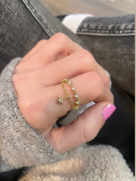 Anello regolabile con catenina e stella polare pendente