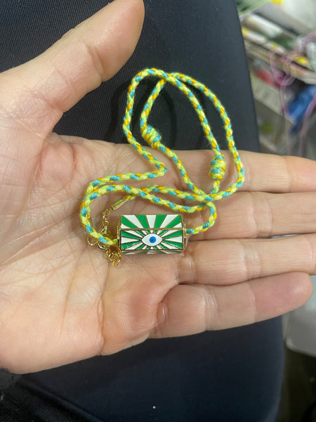 Collana amuleto turco cilindrico con cordino in vari colori