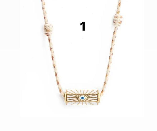 Collana amuleto turco cilindrico con cordino in vari colori