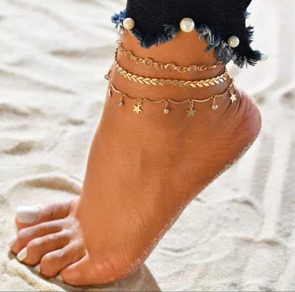 Cavigliera placchette e perle e stelline pendenti