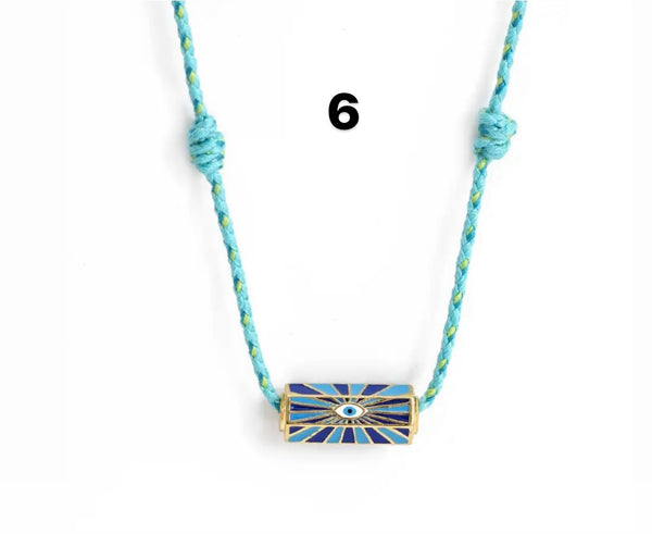 Collana amuleto turco cilindrico con cordino in vari colori