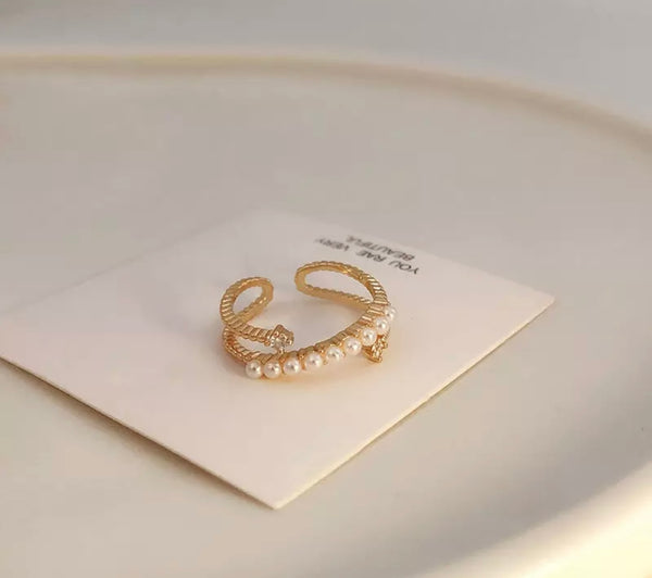 Anello doppio micro perle e punti luce