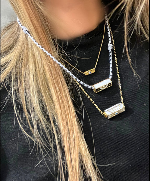 Collana amuleto turco cilindrico con cordino in vari colori